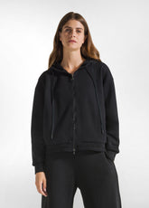 SWEATSHIRT MIT ZIP UND KAPUZE MIT SCHWARZ-DETAILS - Kapuzenpullover | DEHA