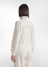FELPA CON ZIP E DETTAGLIO IN VISCOSA EFFETTO STROPICCIATO BIANCO - CREAM | DEHA