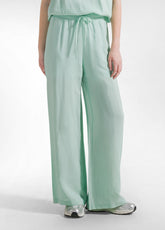 PANTALONI PALAZZO IN SATIN VERDE - JADE GREEN | DEHA