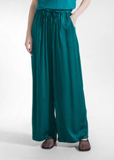 PANTALONI PALAZZO IN SATIN VERDE - PEACOCK GREEN | DEHA