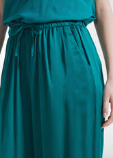 PANTALONI PALAZZO IN SATIN VERDE - PEACOCK GREEN | DEHA