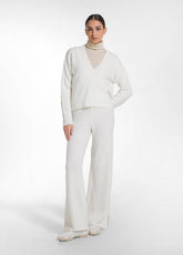 WHITE V-NECK SWEATER AND SEQUIN KNIT TROUSERS SET - | DEHA